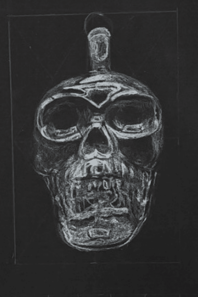 Colored pencil glass skull drawing on black paper 