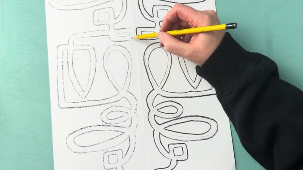 Draw over the freshly transferred drawing to ensure cleaner lines