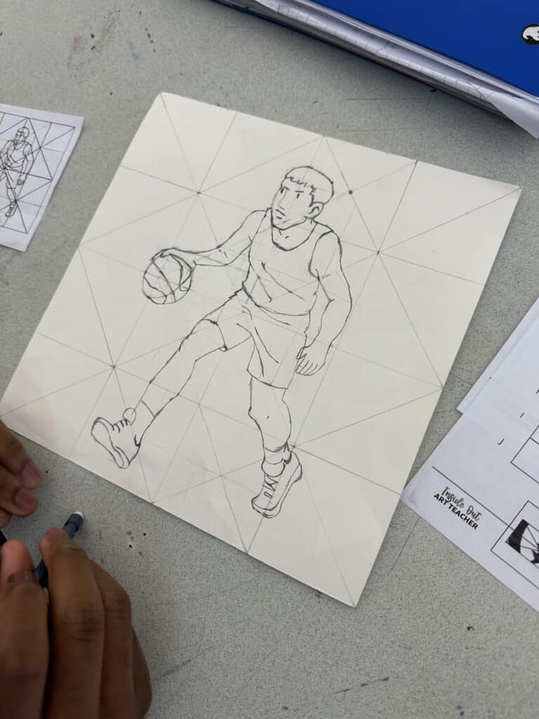 Student example of a high school art curriculum grid drawing project showing a basketball player sketch in progress with proportion and observation practice.