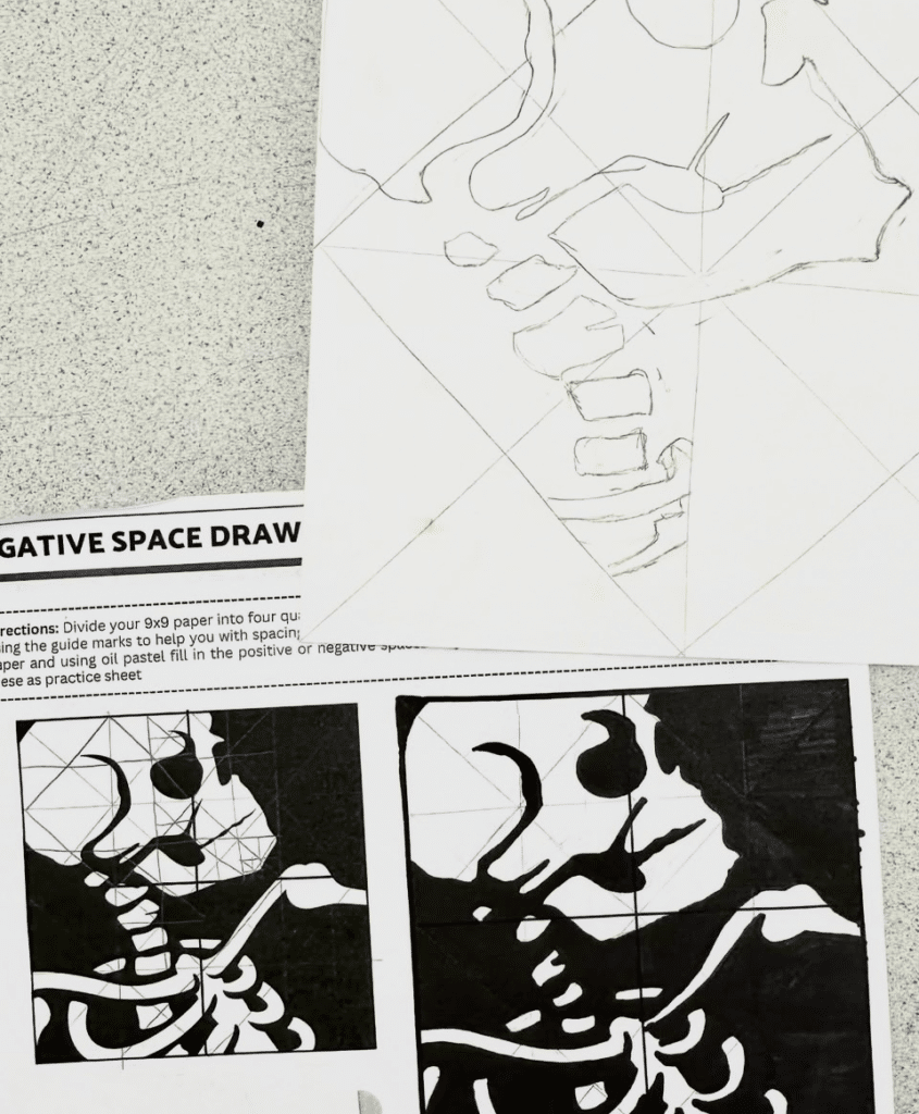 Student example of a high school art curriculum negative space drawing lesson showing a skeleton design in progress with black and white shape studies.
