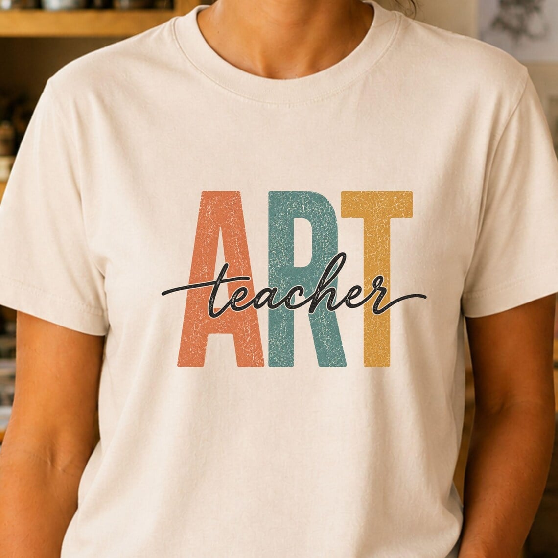 Retro art teacher shirt featuring colorful vintage lettering