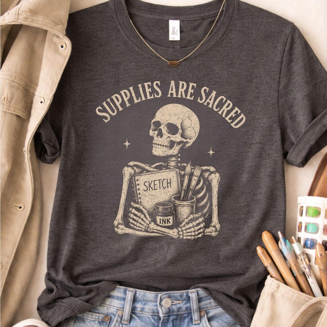 Art supplies shirt featuring Supplies Are Sacred vintage design