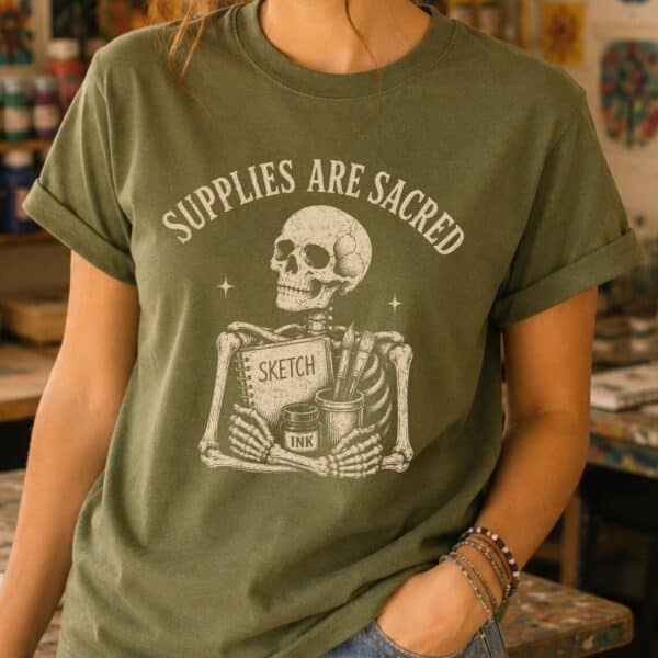 Art teacher graphic tee celebrating art supplies