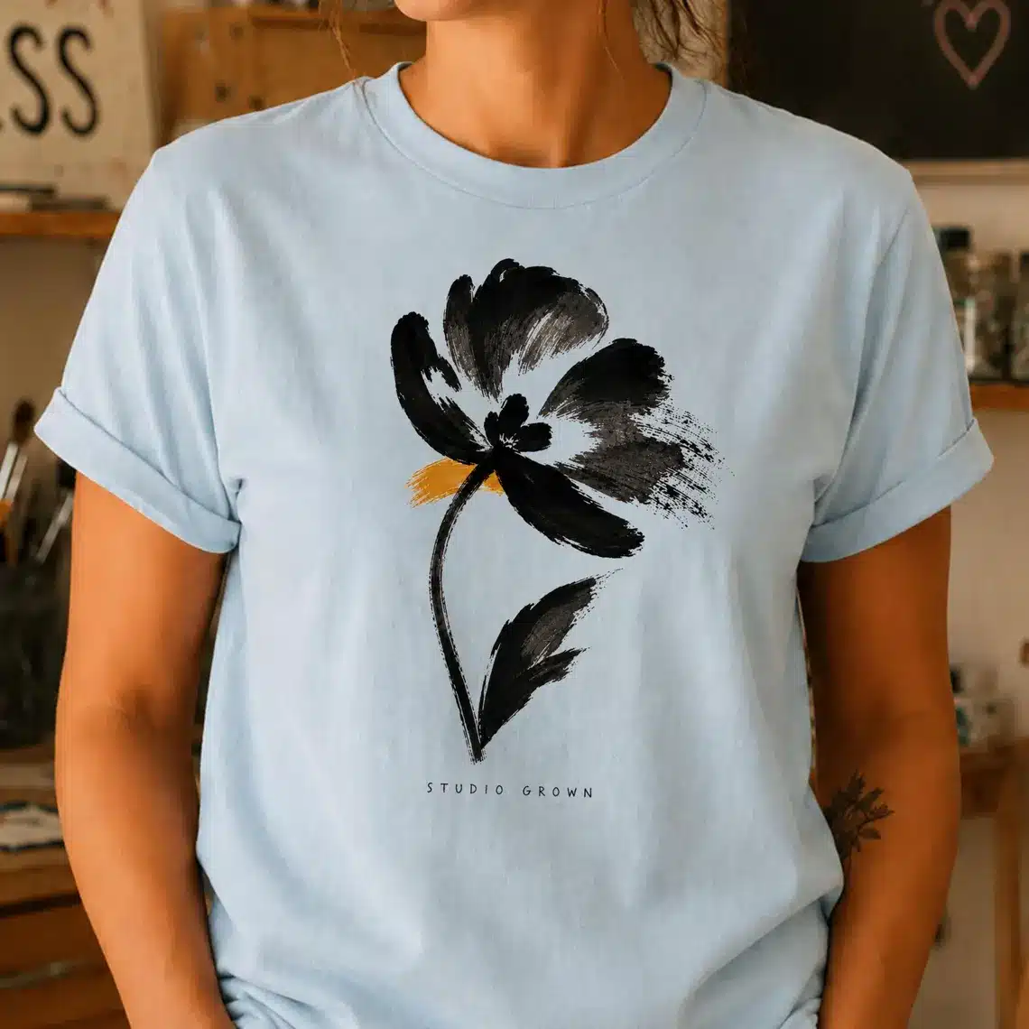 Ink art shirt featuring minimalist black flower illustration
