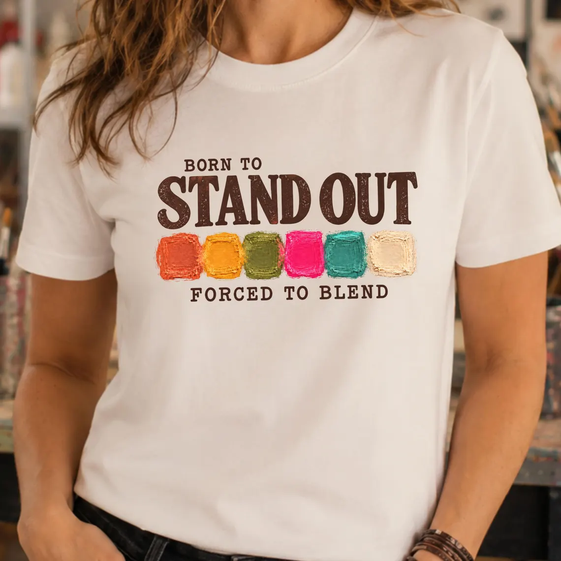 Art teacher humor shirt featuring Born to Stand Out Forced to Blend