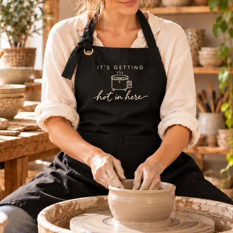 Ceramics apron featuring It's Getting Hot in Here